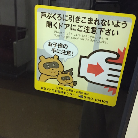 A mascot on a warning sign